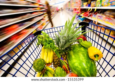 Grocery cart filled with fruits and vegetables