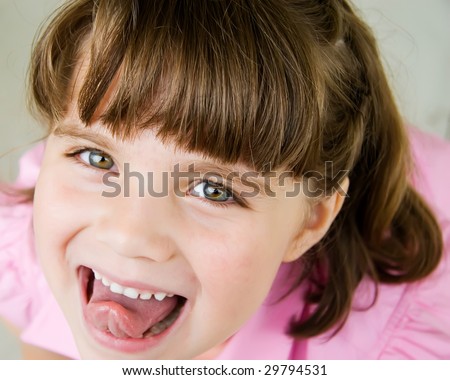 child with tongue sticking out