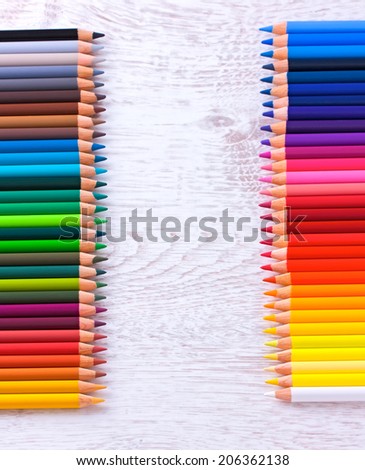 Colour pencils on a white table background