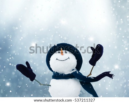 Merry Christmas and happy New Year greeting card .Happy snowman standing in winter  landscape.Snow background.