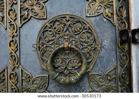 Bronze knocker on the church door
