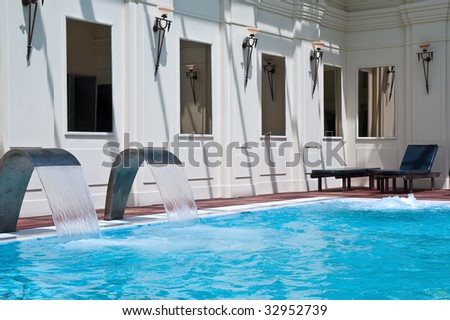 Modern waterfall faucet in a spa swimming-pool