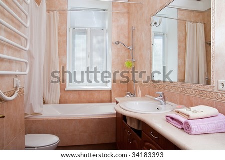 Lamp and mirror on a wall of bathroom