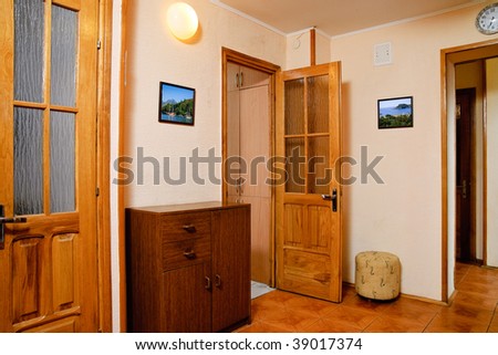 Modern furnished anteroom of apartment. Photos in the frames made by the author