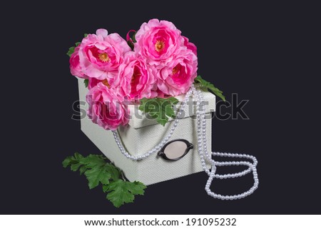 White box, pink flowers and pearl beads on gray