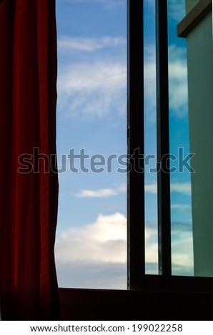 An image of an open window and beautiful sky