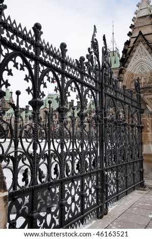 Gates to Parliament Hill in Ottawa, Canada.   The gates are closed except on special occasions for security reasons.   The concrete gate houses show signs of deterioration and repair