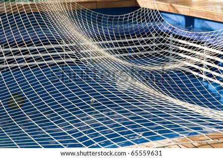 empty swimming pool with safety net