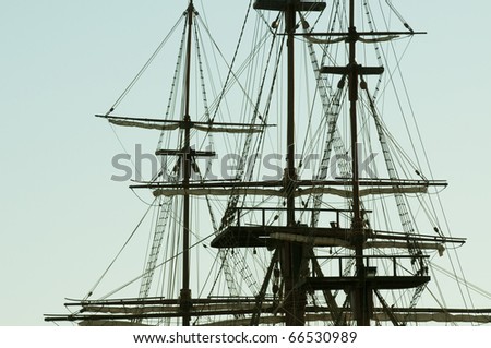 the ropes and rolled sails of tall ship