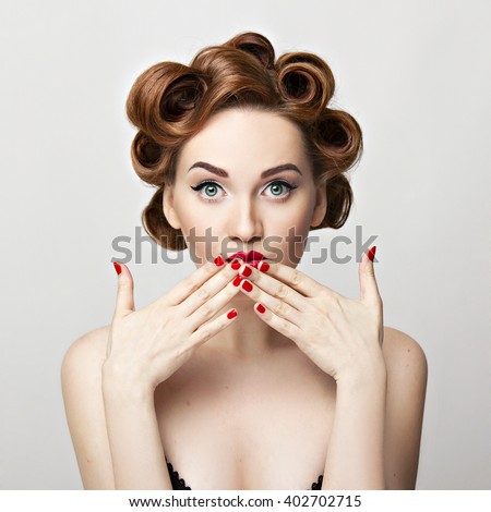 Beautiful woman pinup style portrait. Perfect manicure, makeup and hair.