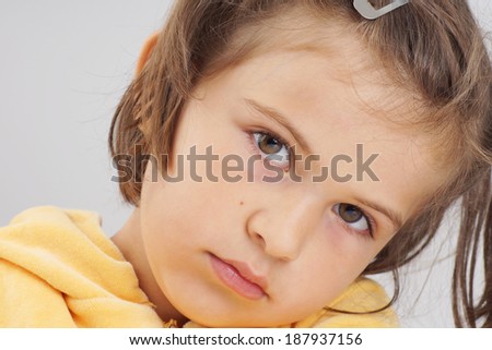 Soft portrait of cute but serious little girl
