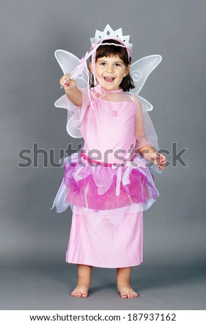 Cute little girl dressed up as pink fairy princess