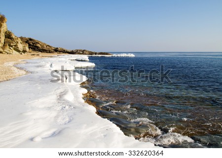 Ice Floe, Icy shore of the sea,  North sea, cold sea of the North, winter ice, white snow of the Arctic, Arctic ocean, beautiful nature. Beach at the winter ocean. Spring Arctic. Melting of ice