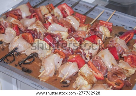 Chicken skewers, made of red pepper, parma ham and chicken