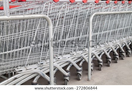 Shopping carts in a supermarket arranged in rows