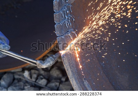 Metal cutting with a gas burner and many sparks