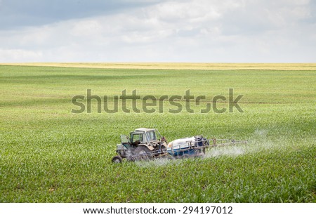 Polski Trambesh - May 27: Landscape with tractor sprayer carried chemical treatment of crops against pests on May 27, 2015, Polski Trambesh, Bulgaria