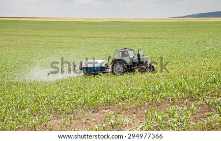Polski Trambesh - May 27: Landscape with tractor sprayer carried chemical treatment of crops against pests on May 27, 2015, Polski Trambesh, Bulgaria