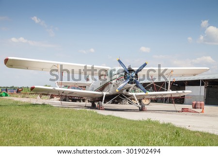 Polski Trambesh - May 30: Front plan dipteral aircraft used in agricultural aviation in grassy flat area on 30 May 2015 Polski Trambesh, Bulgaria