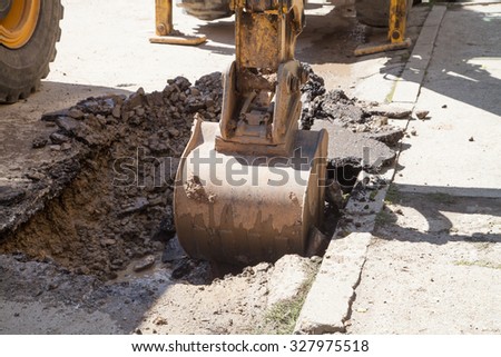 Gorna Oryahovitsa - September 14: Repair of street water installation with heavy machinery and hand-urban arm of the September 14, 2015, Gorna Oryahovitsa,