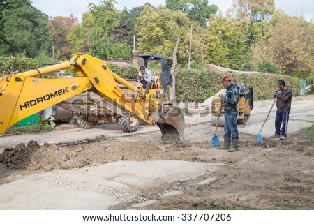 Gorna Oryahovitsa - October 18: Construction Site - repairs. Workers and machines prepare the installation of drainage manholes and street pavement of October 18, 2015, Gorna Oryahovitsa, Bulgaria