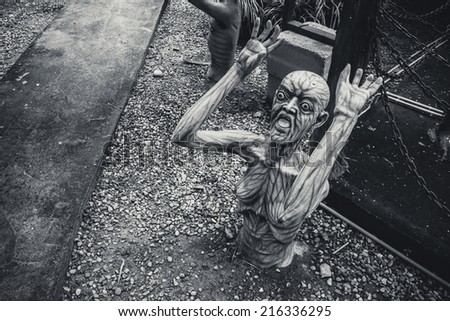 scary ghost sculpture in black and white