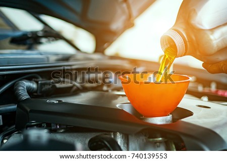 Hand mechanic in repairing car,Change the Oil