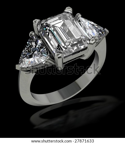 stock photo Emerald and trillion cut diamond engagement ring on black