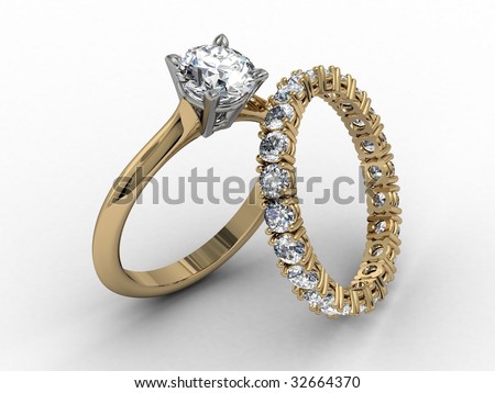 stock photo two tone diamond wedding ring set on matt white background