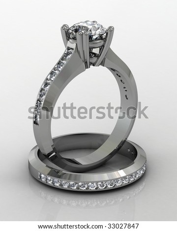 stock photo platinum diamond wedding ring set on reflective white 