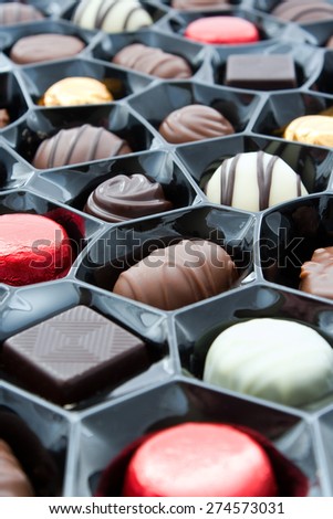 Box of chocolates at an angled overhead view with a shallow depth of field