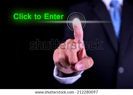 a finger tip of business man and a word of click to enter
