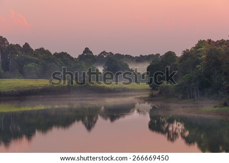 Reflection of the landscape before sunset at the water reservoirs, Khao Yai National Park