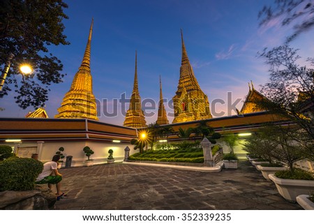 Evening in Wat Pho, the official name being Wat Phra Chetuphon Vimolmangklararm Rajwaramahaviharn. You can see the famous 4 huge pagodas in the scene. This is one of attractive temple in Bangkok.