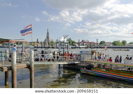 BANGKOK - JULY 3: Group of people aboarding to chao phraya ferry boat, Chao Phraya is a major river in Thailand, low alluvial plain forming the centre of the country. July 3, 2014 in Bangkok,Thailand