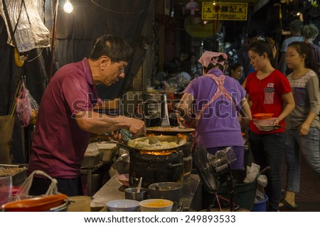 Bangkok, Thaoland - 31 January 2015 : chinese chef cooking a chinese food at bangkok chinatown on Yaowarat Road, many chinese food vendor around bangkok chinatown.