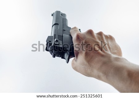 hand holding a handgun