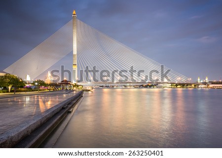 Bangkok, Thailand - January 9, 2015: Rama VIII Bridge one of the Rope Bridge across the Chao Phraya River; many people come to relax and exercise in this area.