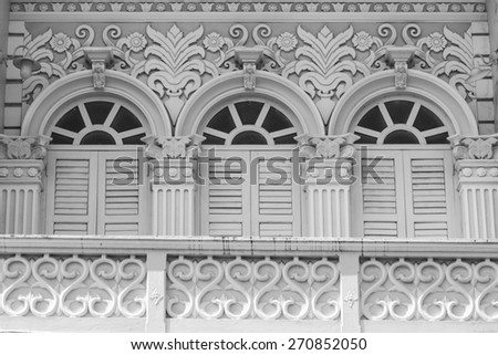 Retro wooden windows and decoration of Chino-Portuguese style architecture in Phuket, Thailand