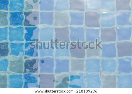 A pool with random ceramic tiles and water ripple effect