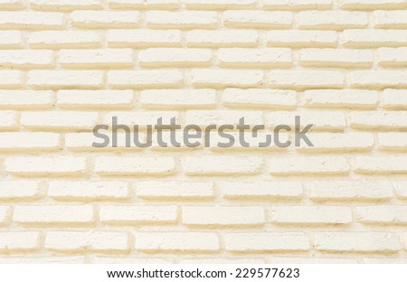 Cream color paint brick wall background