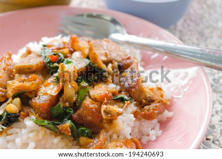 Thai food. Fried basil leave with crisp pork on rice