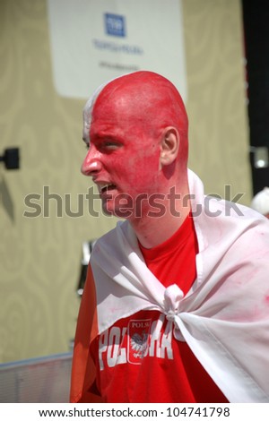 WROCLAW, POLAND - JUNE 8: Unidentified young male fan with painted face for Euro 2012 on June 8, 2012 in Wroclaw. The EURO 2012 will be held from June 8 - July 1, 2012 hosted by Poland and Ukrain