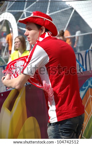 WROCLAW, POLAND - JUNE 8: Unidentified male football fan of Euro 2012 with national colors on June 8, 2012 in Wroclaw. The EURO 2012 will be held from June 8 - July 1, 2012 hosted by Poland and Ukrain