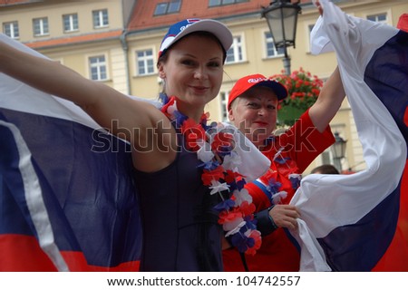 WROCLAW, POLAND - JUNE 8: Unidentified two Russian female fans go to Wroclaw\'s fanzone on June 8, 2012 in Wroclaw. The EURO 2012 will be held from June 8 - July 1, 2012 hosted by Poland and Ukraine.