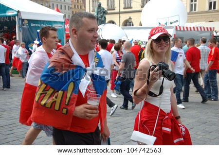 WROCLAW, POLAND - JUNE 8: Unidentified Russian couple visits Euro 2012 fanzone on June 8, 2012 in Wroclaw. The EURO 2012 will be held from June 8 - July 1, 2012 hosted by Poland and Ukraine.