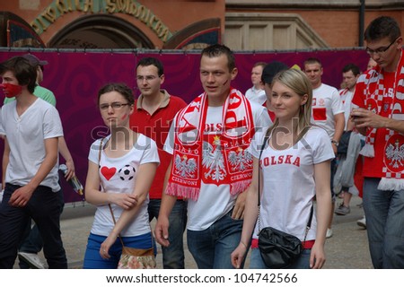 WROCLAW, POLAND - JUNE 8: Unidentified Polish fans go for the first game of Euro 2012 on June 8, 2012 in Wroclaw. The EURO 2012 will be held from June 8 - July 1, 2012 hosted by Poland and Ukraine.