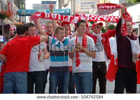 WROCLAW, POLAND - JUNE 8: Unidentified group of young Polish football fans cheers on June 8, 2012 in Wroclaw. The EURO 2012 will be held from June 8 - July 1, 2012 hosted by Poland and Ukraine.