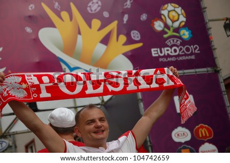 WROCLAW, POLAND - JUNE 8: Unidentified male football fan at Euro 2012 fanzone entrance on June 8, 2012 in Wroclaw. The EURO 2012 will be held from June 8 - July 1, 2012 hosted by Poland and Ukraine.