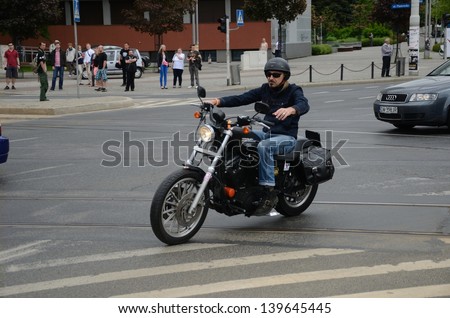 WROCLAW, POLAND - MAY 18: Unidentified motorcyclist rides Harley-Davidson in city center. Around 8 thousands riders joined Super Rally on 18 May 2013 in Wroclaw, Poland.